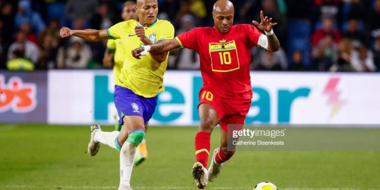 LE HAVRE, FRANCE - SEPTEMBER 23: Andre Ayew #10 of Ghana controls the ball against Richarlison #9 of Brazil during the international friendly match between Brazil and Ghana at Stade Oceane on September 23, 2022 in Le Havre, France. (Photo by Catherine Steenkeste/Getty Images)