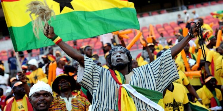 A Ghanian supporter cheers on January 20, 2013 before the start of a 2013 Africa Cup of Nations football match between Ghana and the Democratic Republic of Congo at the Nelson Mandela Bay Stadium in Port Elizabeth. AFP PHOTO / STEPHANE DE SAKUTIN