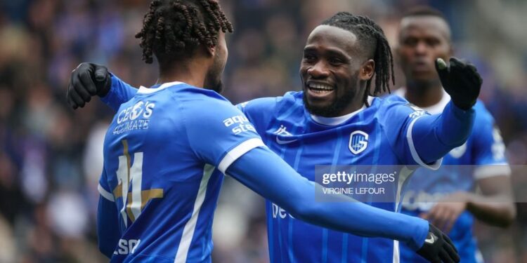 Genk's Ghanaian midfielder Joseph Paintsil (C) celebrates with Genk's Belgian midfielder Mike Tresor Ndayishimiye (L) after scoring his teams fifth goal during the Belgian Pro League football match between KRC Genk and RSC Anderlecht in Genk on April 16, 2023. (Photo by VIRGINIE LEFOUR / Belga / AFP) / Belgium OUT (Photo by VIRGINIE LEFOUR/Belga/AFP via Getty Images)