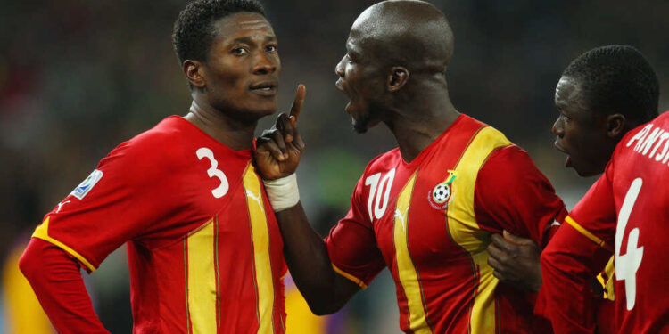 Stephen Appiah of Ghana shouts at team mate Asamoah Gyan after he missed a late penalty, which would have handed Ghana the win.