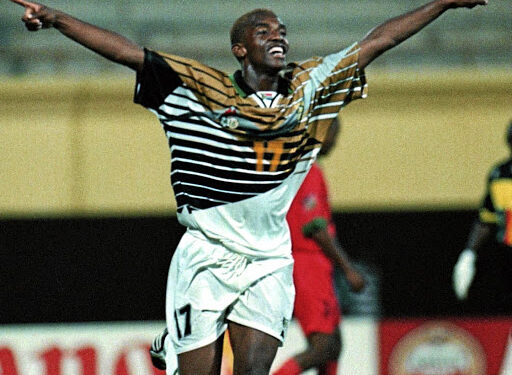 980219CC04:INTERNATIONAL:SPORT:SOCCER:FEB98 - Bafana Bafana striker Benni McCarthy celebrates scoring one of four goals against Namibia during the 1998 Africa Nations Cup. (Photo by Coca-Cola / PictureNET Africa)