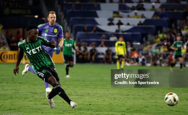 NASHVILLE, TN - AUGUST 24: Austin FC midfielder Osman Bukari (7) scores a goal from midfield in front of Nashville SC goalkeeper Joe Willis (1) during a match between Nashville SC and Austin FC, August 24, 2024 at GEODIS Park in Nashville, Tennessee (Photo by Matthew Maxey/Icon Sportswire via Getty Images)