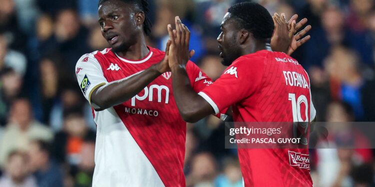Monaco's French midfielder #19 Youssouf Fofana (R) celebrates with teammate Monaco's Ghanaian defender #22 Mohammed Salisu (L) after scoring his team's second goal during the French L1 football match between Montpellier Herault SC and AS Monaco at Stade de la Mosson in Montpellier, southern France, on May 12, 2024. (Photo by Pascal GUYOT / AFP) (Photo by PASCAL GUYOT/AFP via Getty Images)